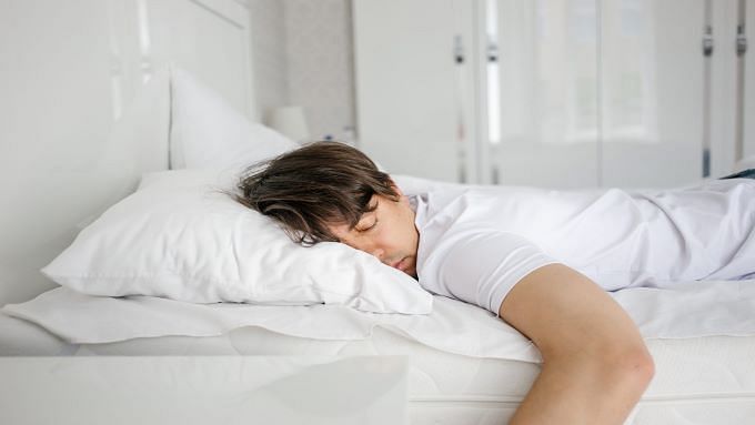 Young Man Sleeping Soundly In Bed Scaled